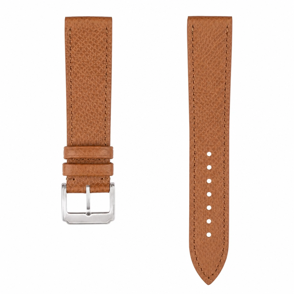 Brown leather watch strap with silver-tone buckle on white background