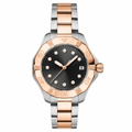 Two-tone rose gold and silver metal watch with black dial and diamond-style markers
